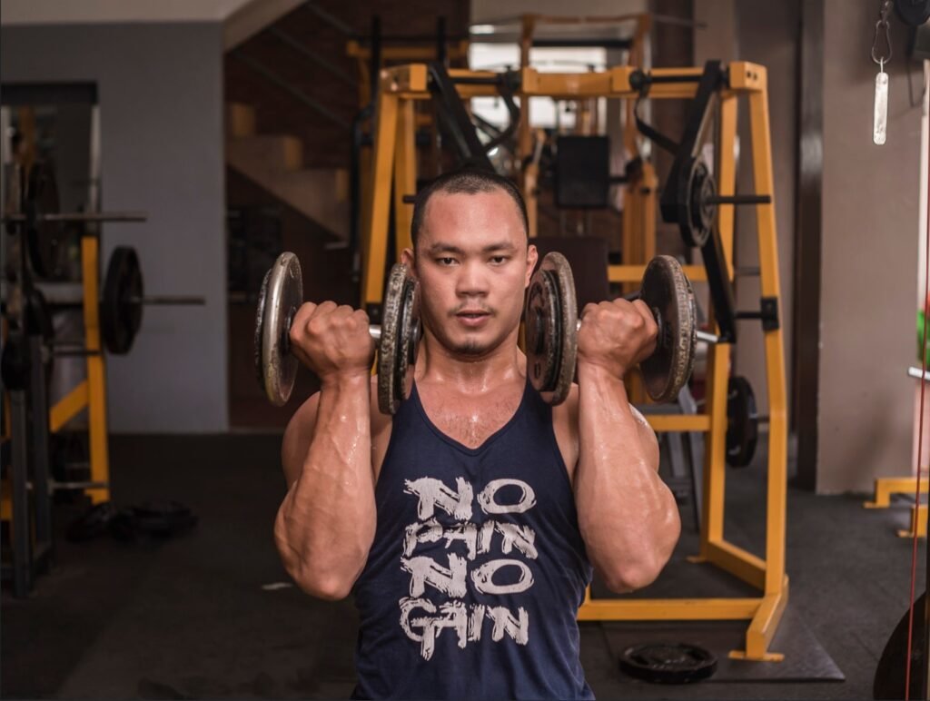 A man doing a Seated Arnold Press