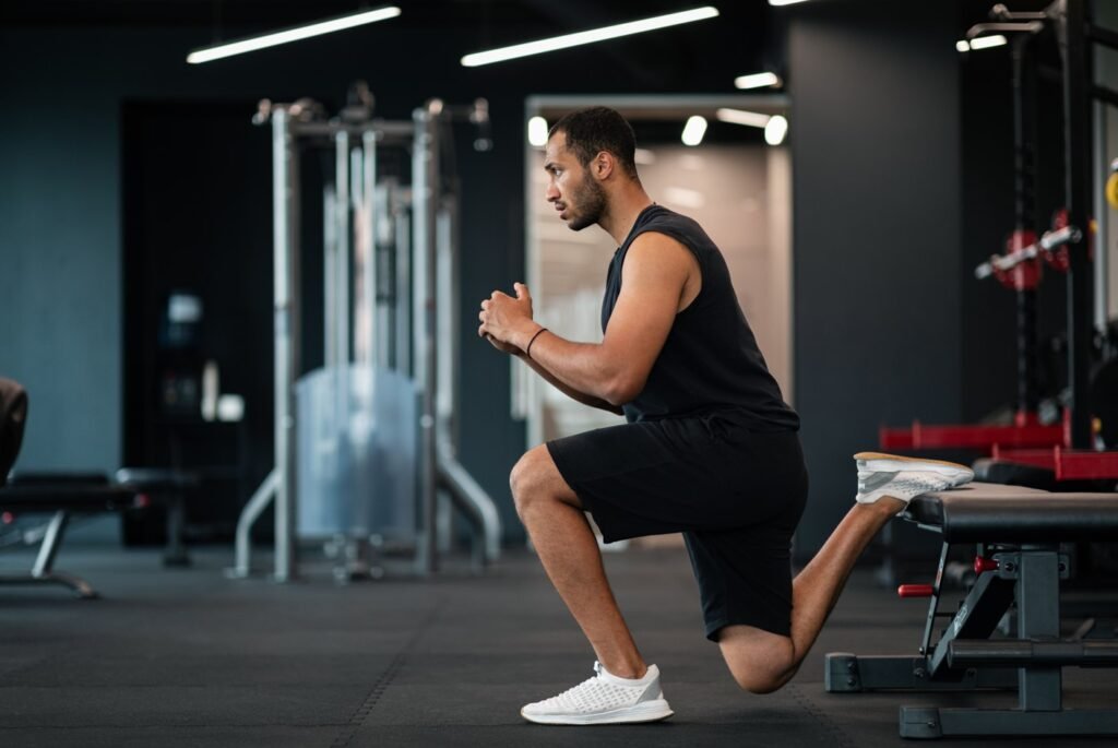 A man performing a Bulgarian split squat 
