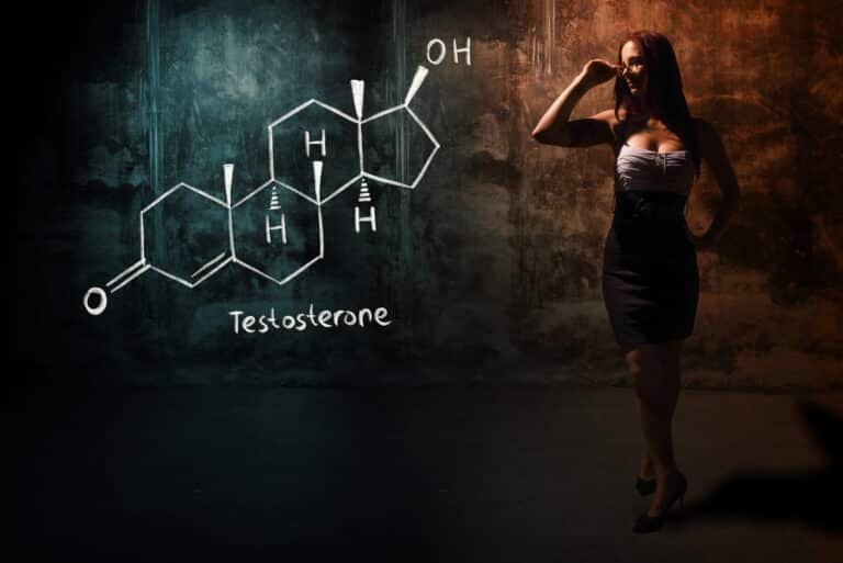 Sexy girl or secretary or female student presenting handdrawn chemical formula of testosterone